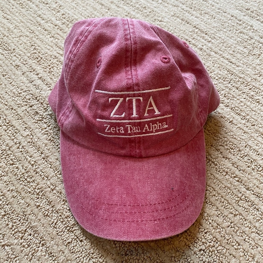 Faded red Zeta Tau Alpha (ZTA) adjustable hat